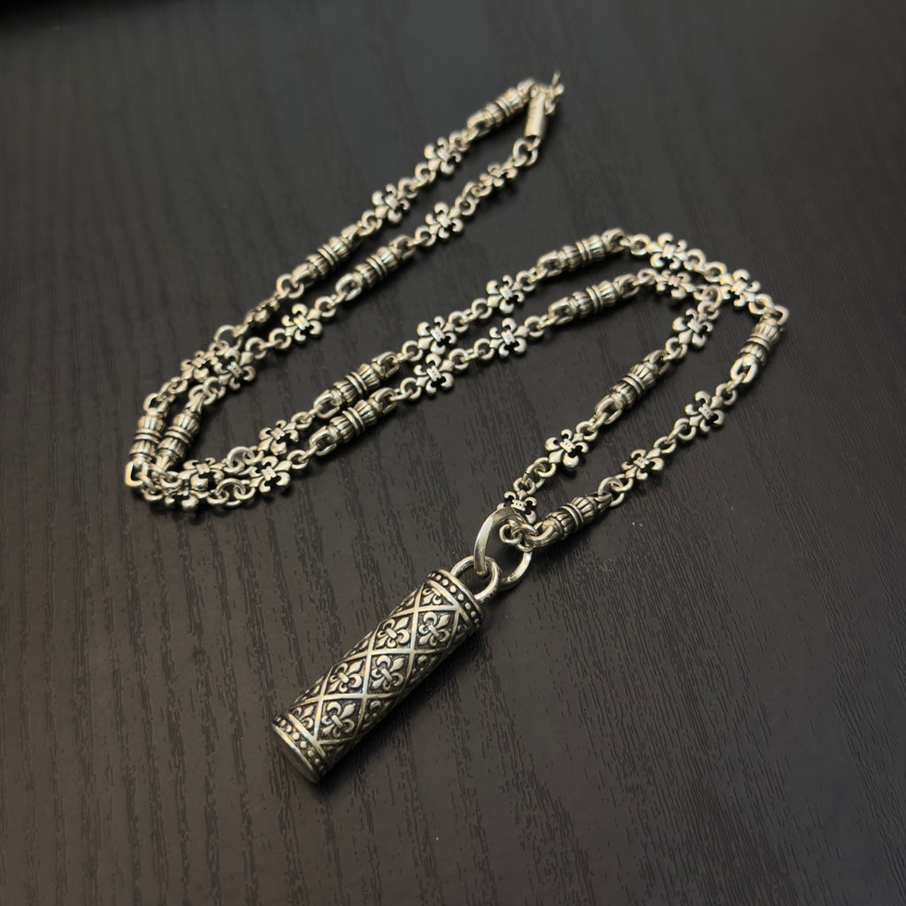 Gold-tone chain necklace with rectangular etched pendant and linked chain