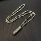 Gold-tone chain necklace with rectangular etched pendant and linked chain