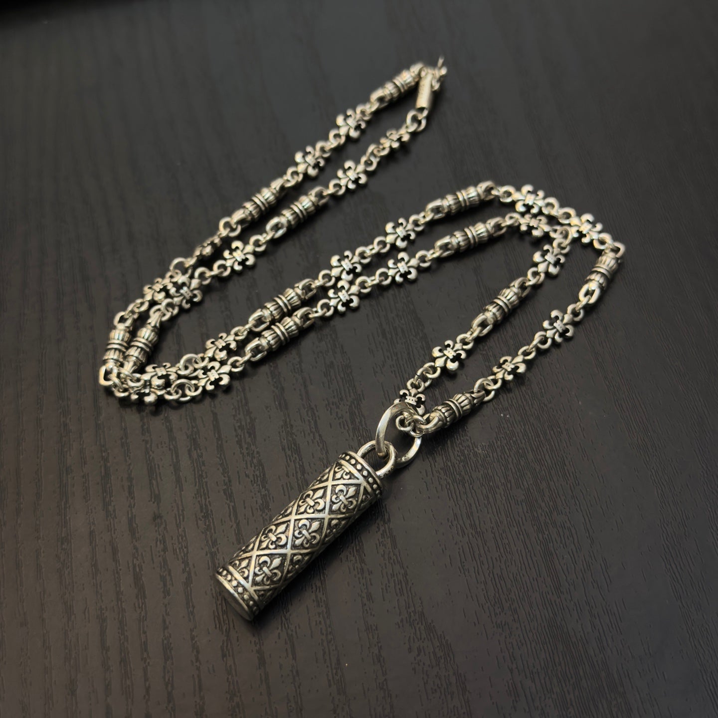 Gold-tone chain necklace with rectangular etched pendant and linked chain