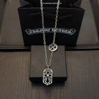 Silver-tone pendant necklace with shield-shaped charm and long chain
