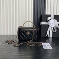 Black quilted mini crossbody bag with gold chain strap and Chanel logo on front