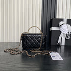Black quilted mini crossbody bag with gold chain strap and Chanel emblem front