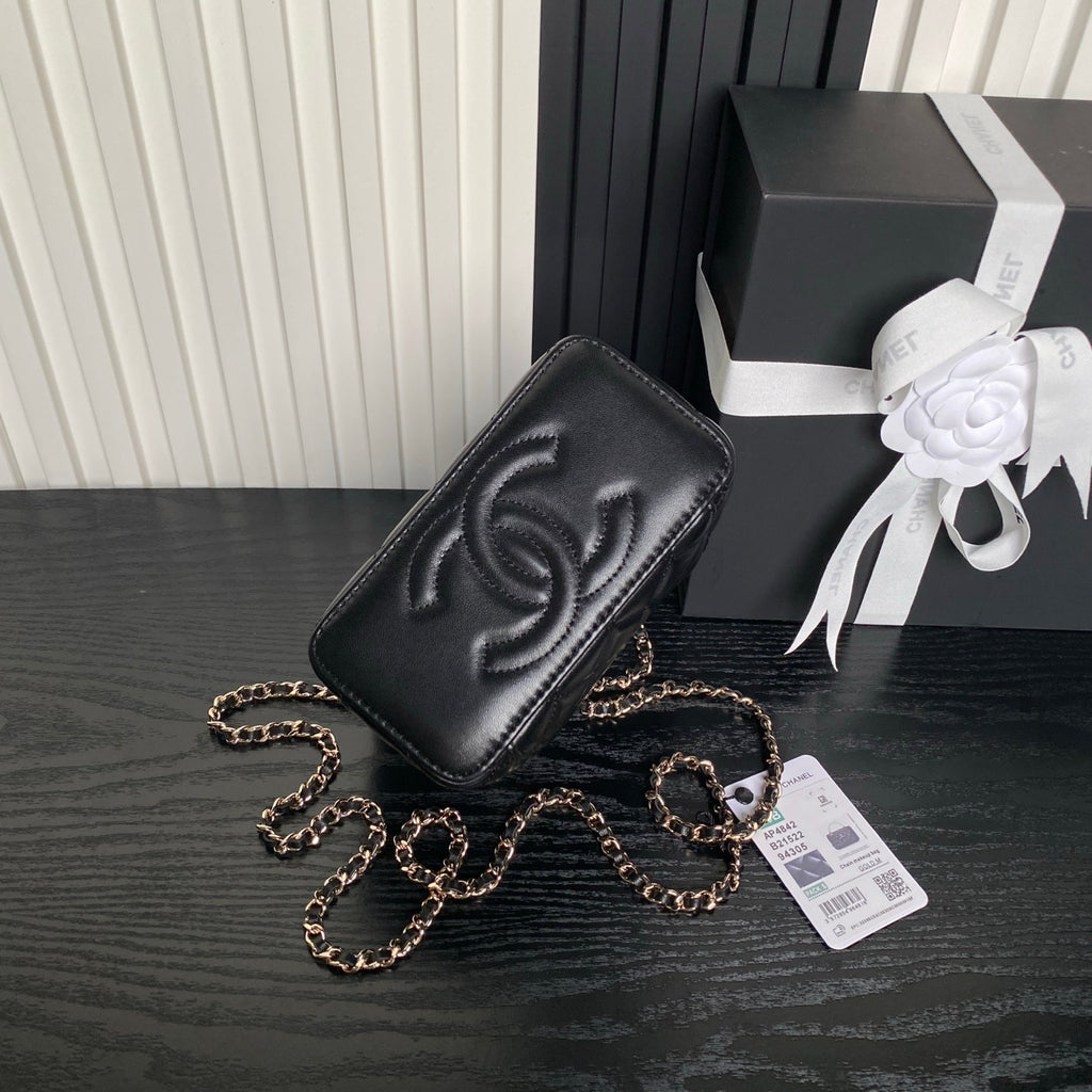 Black quilted mini crossbody bag with Chanel-style CC emboss and gold chain strap