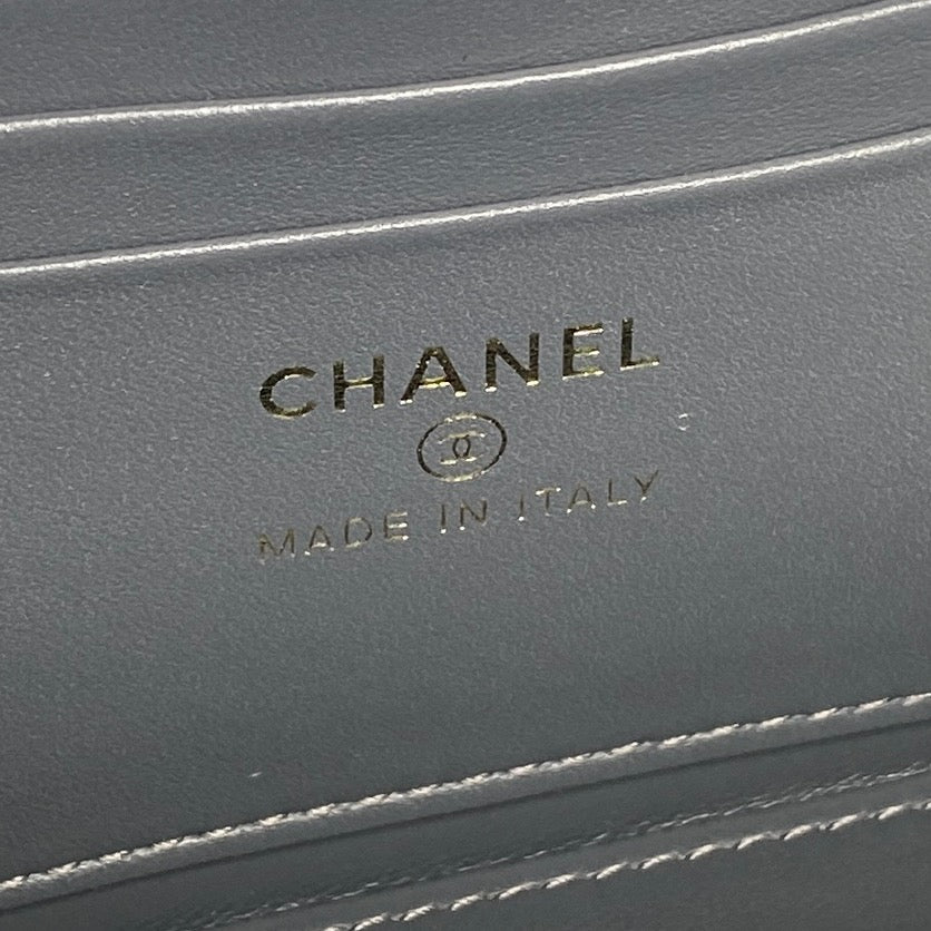 CHANEL made in Italy stamp on blue leather mini handbag exterior