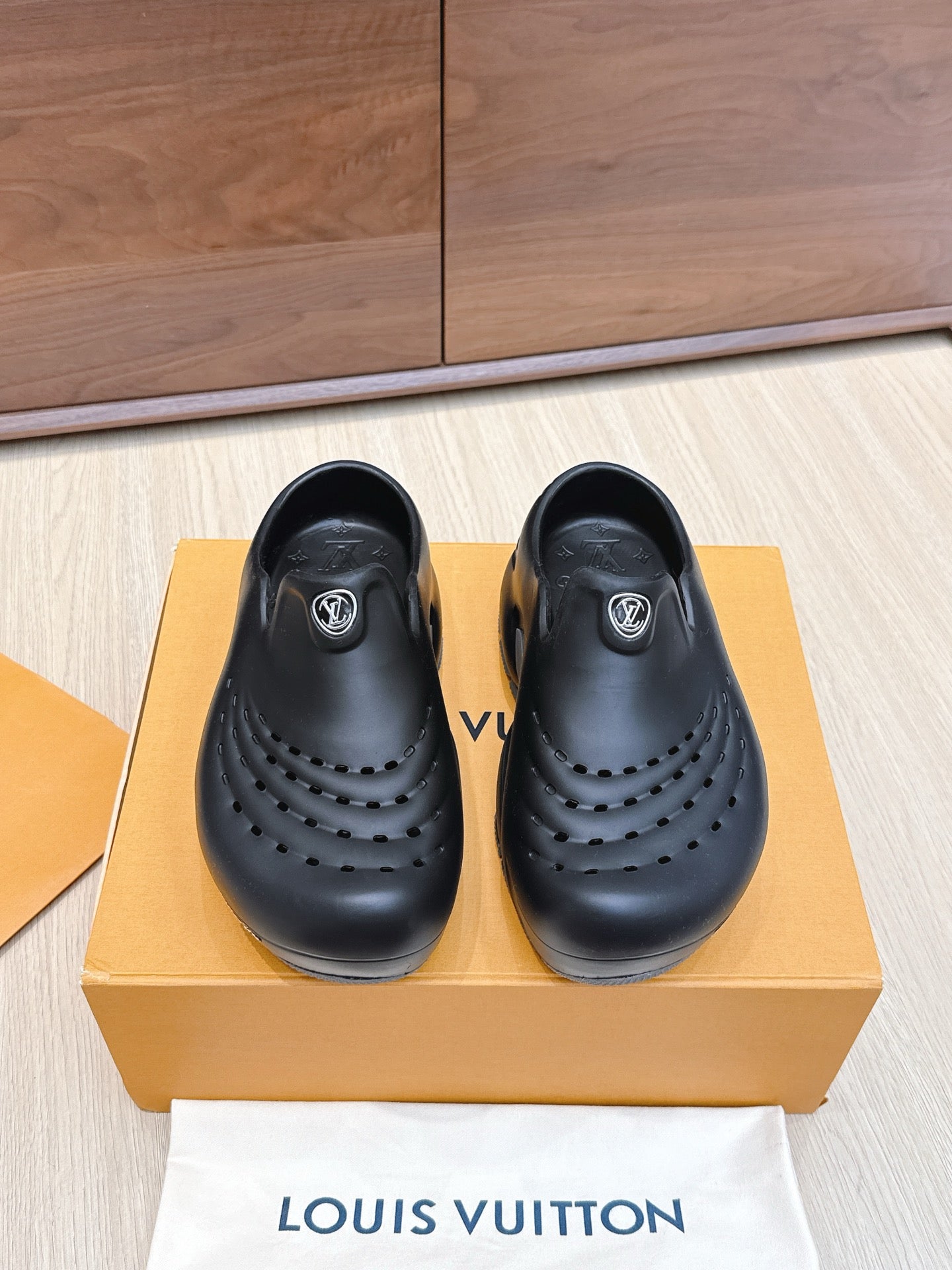 Louis Vuitton black clogs-style sandals with perforations and padded strap detail