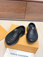 Louis Vuitton black clogs with toe perforations and logo patch on vamp