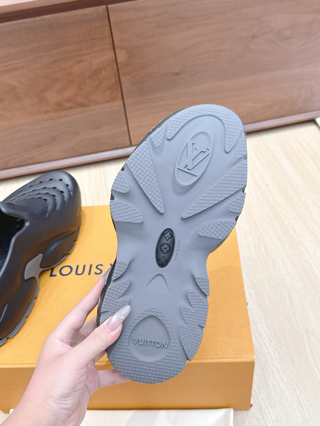Louis Vuitton gray rubber outsole with tread pattern and embossed LV logo
