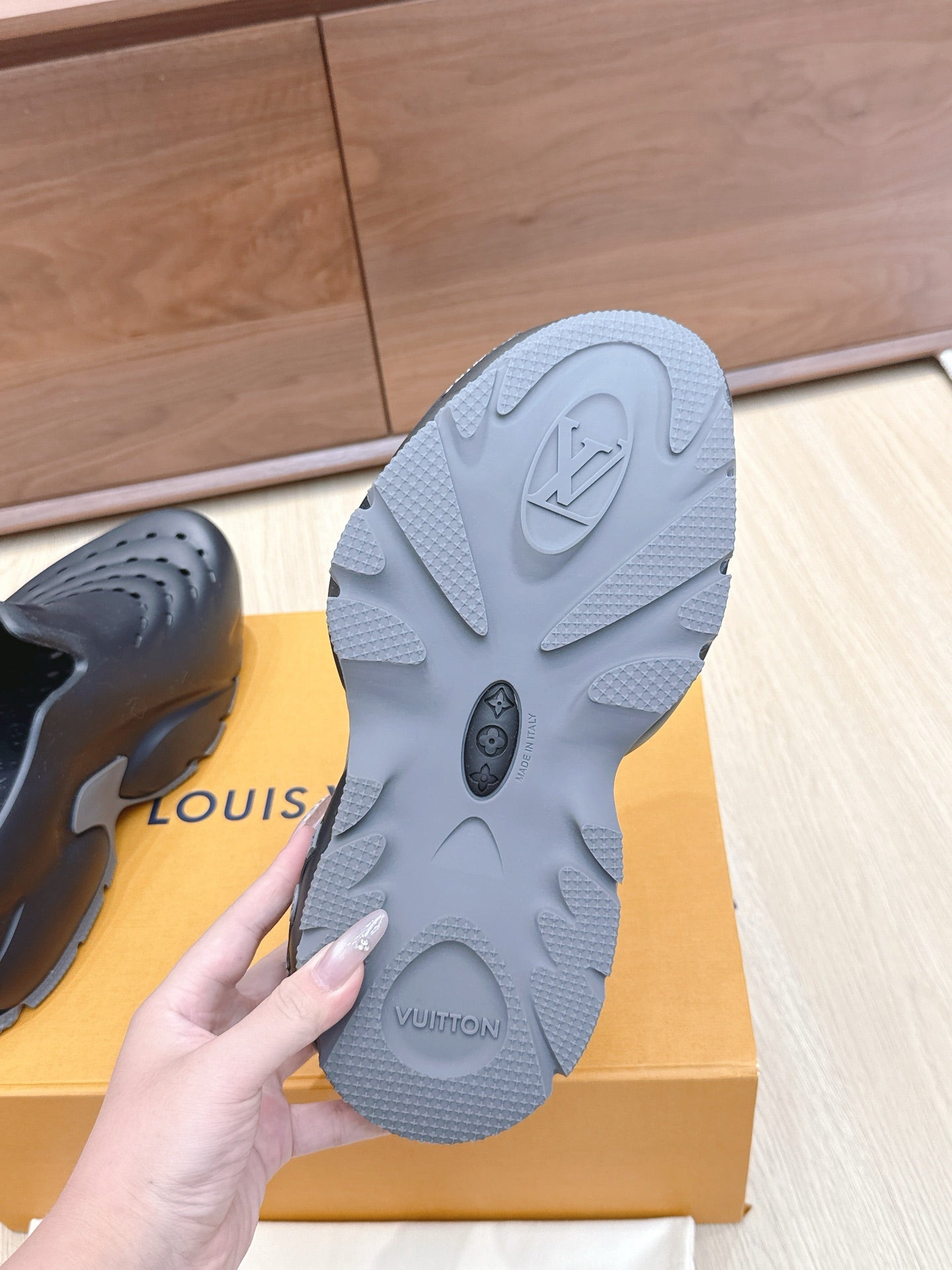 Louis Vuitton gray rubber outsole with tread pattern and embossed LV logo