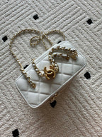 Chanel quilted mini bag with gold chain strap, white with stitched front