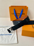 Louis Vuitton monogram belt with large silver LV buckle on dark navy strap