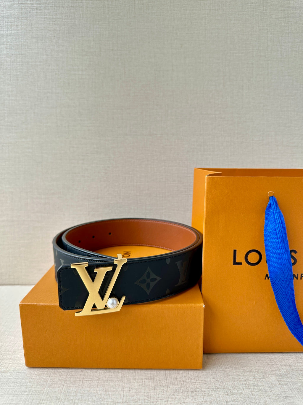 Louis Vuitton monogram belt with gold LV buckle and dark navy strap
