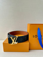 Louis Vuitton monogram belt with gold LV buckle and dark navy strap