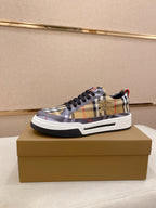 Plaid low-top sneakers with black laces, check pattern and white rubber sole, gold logo patch