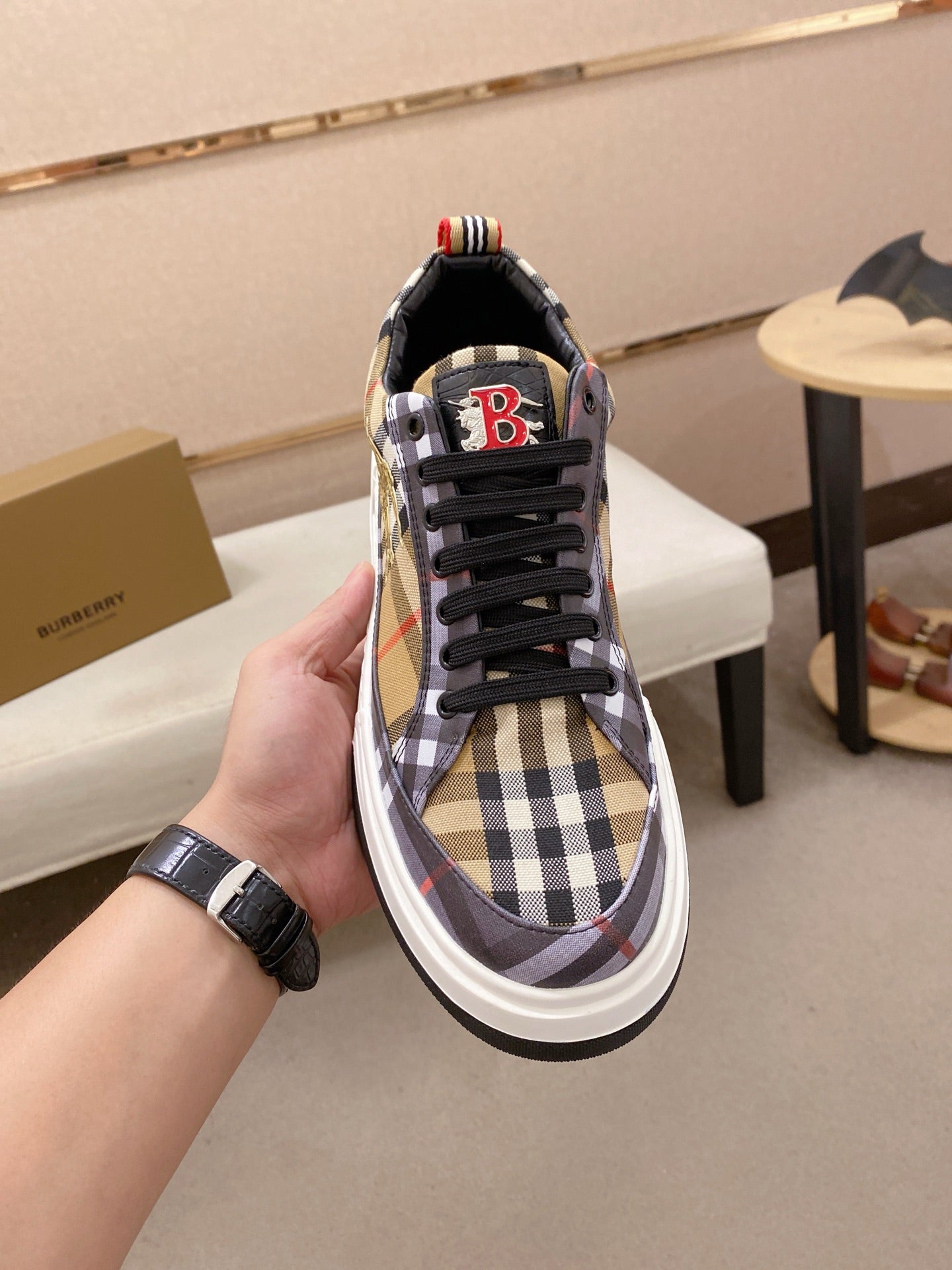 Plaid low-top sneakers with black laces, red B logo patch on heel, white rubber sole
