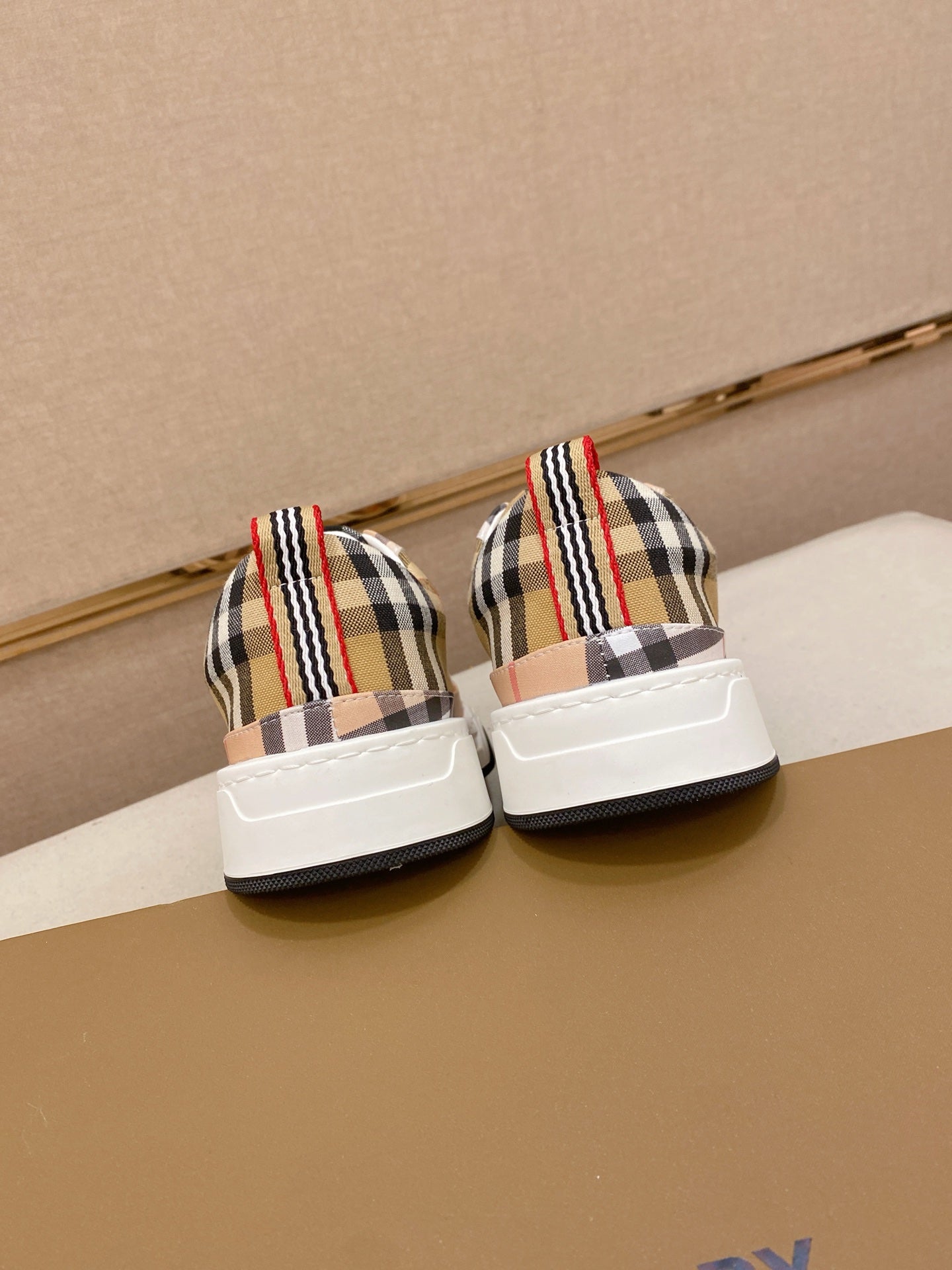 Plaid low-profile sneakers, pair shown from back with white soles