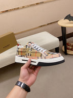 Plaid low-top sneaker with gold bee emblem, white laces and thick sole
