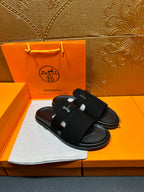 Hermes black slide sandals with wide strap and H logo buckle