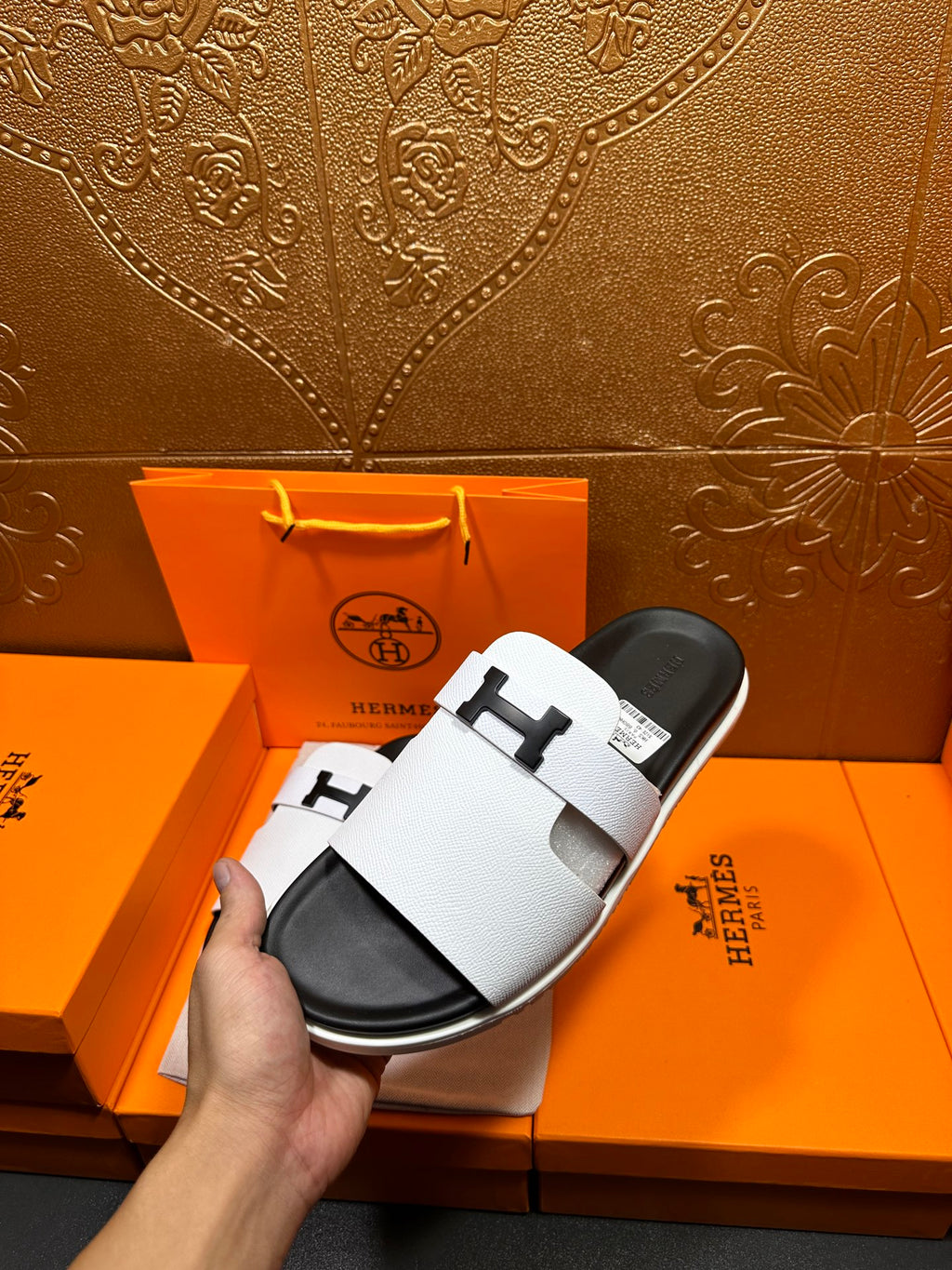 Hermes slide sandals, white strap sandals with black soles, side angle