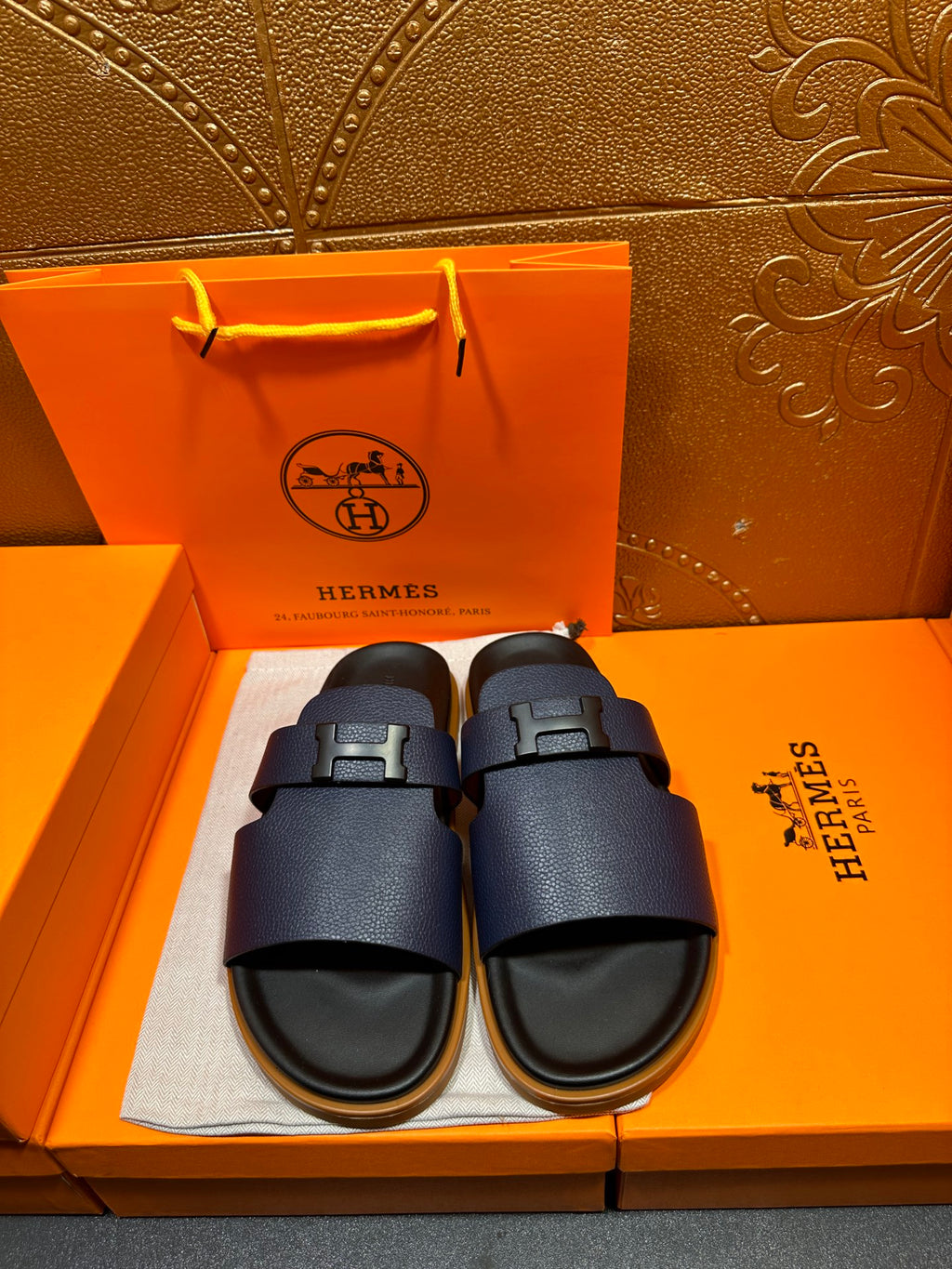 Hermes dark blue slide sandals with two wide buckle straps