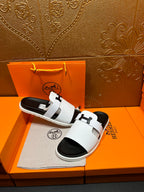 Hermes slide sandals, white leather-look straps with black rubber soles