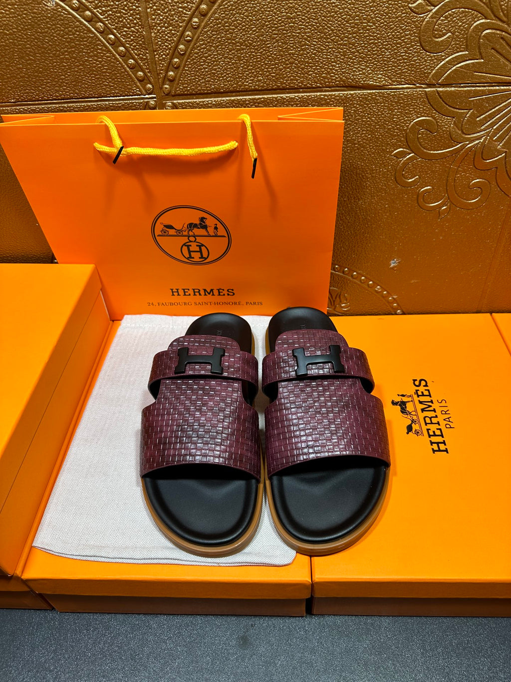 Hermes slide sandals, burgundy textured strap with black buckle and black footbed