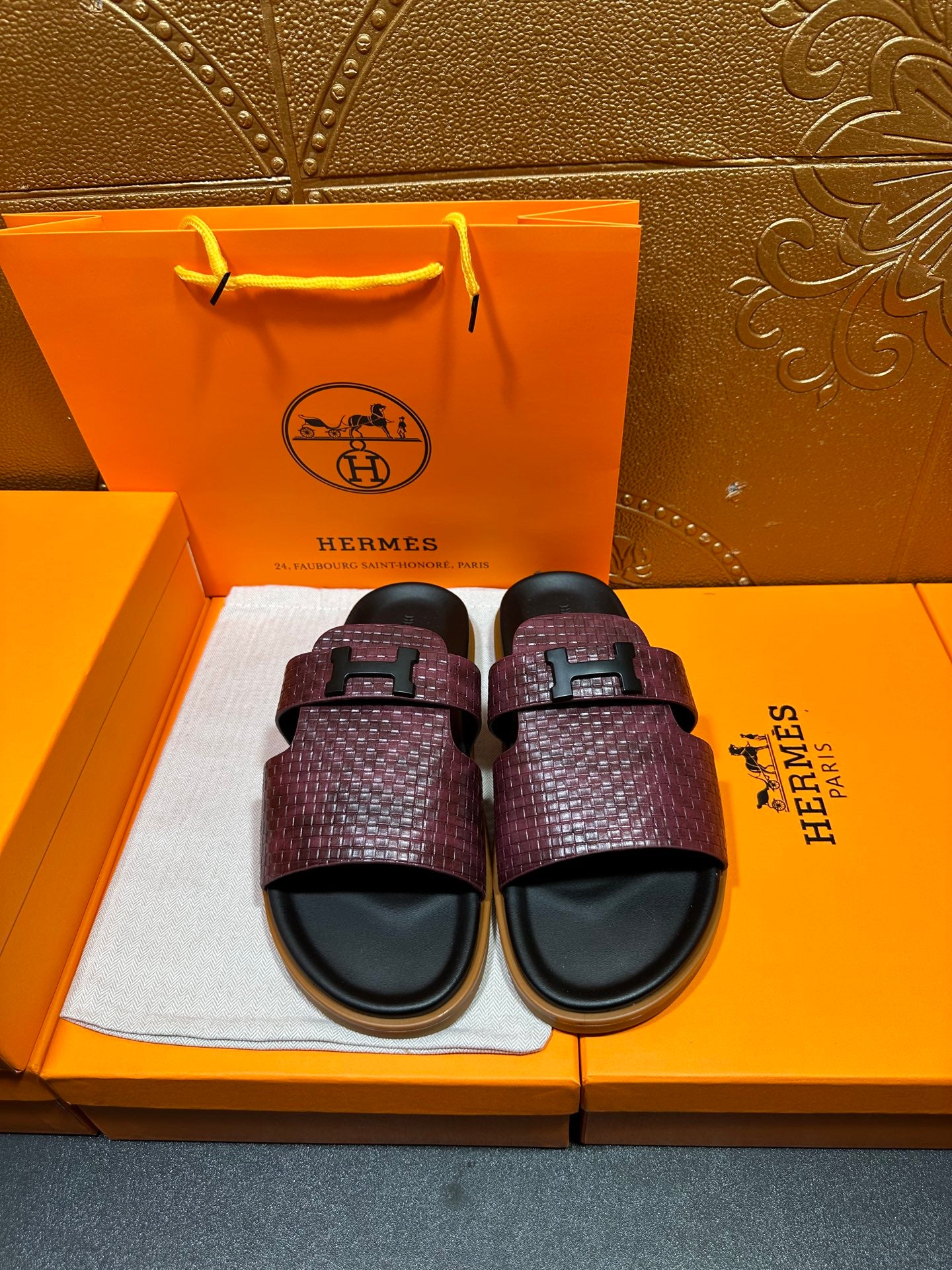Hermes slide sandals, burgundy textured strap with black buckle and black footbed