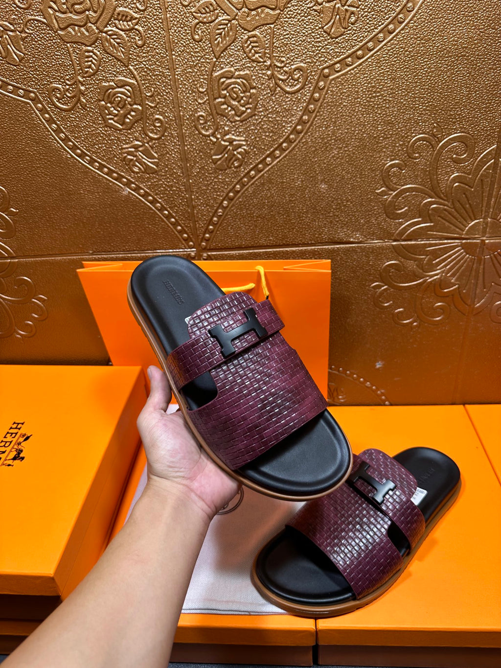Hand-held Hermes slide sandal, burgundy textured strap with black squared logo buckle