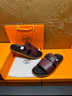 Hermes slide sandals, burgundy textured upper with black footbed and embossed logo buckle