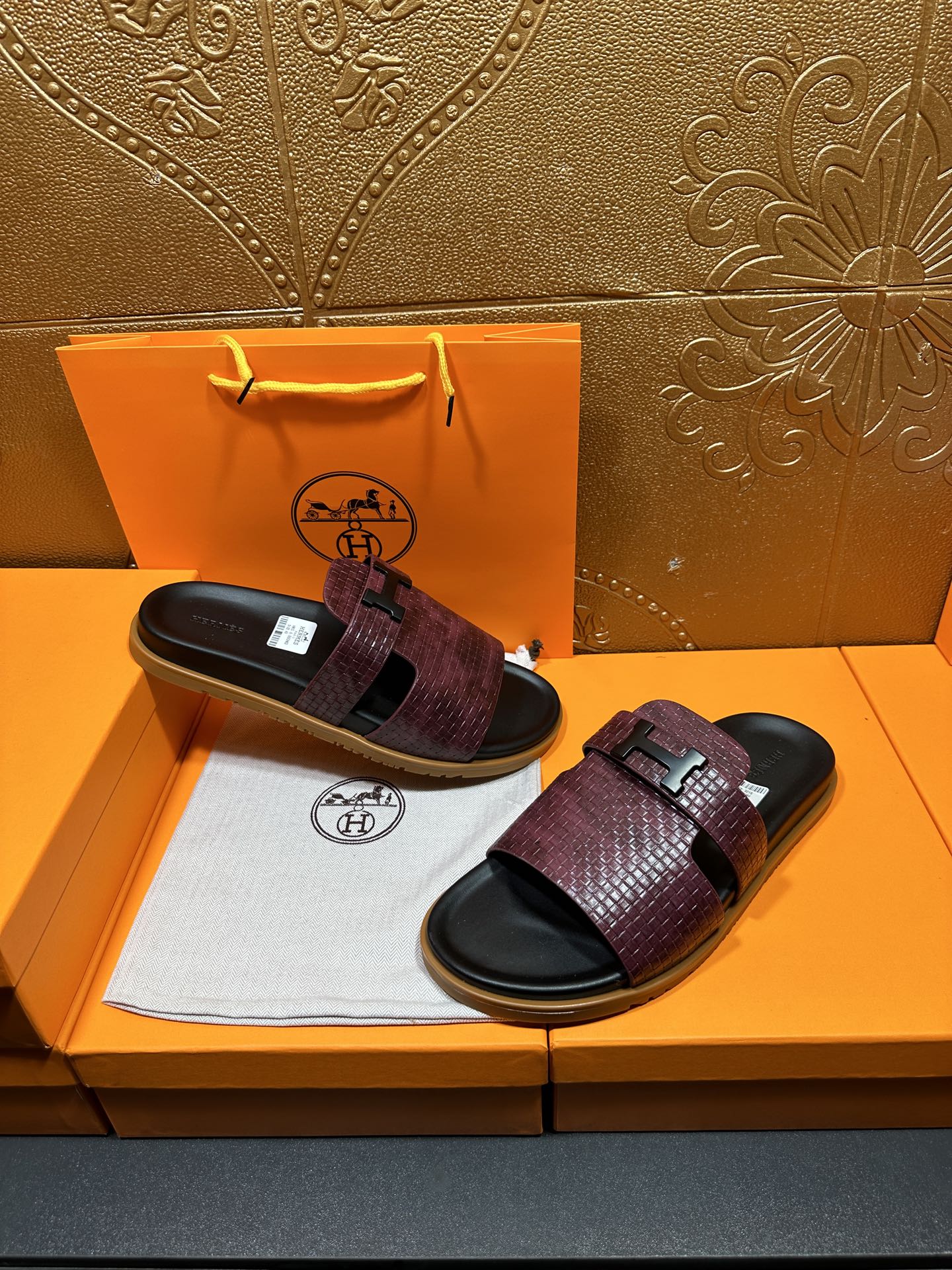 Hermes slide sandals, burgundy textured upper with black footbed and embossed logo buckle