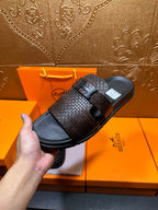 Hermes textured slide sandals held together, dark brown strap with black buckle