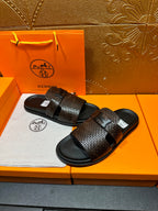 Hermes textured slide sandals, dark brown strap with black buckle over black soles