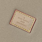 Beige inner label with 'LOUIS VUITTON' and 'Made in France' in red border