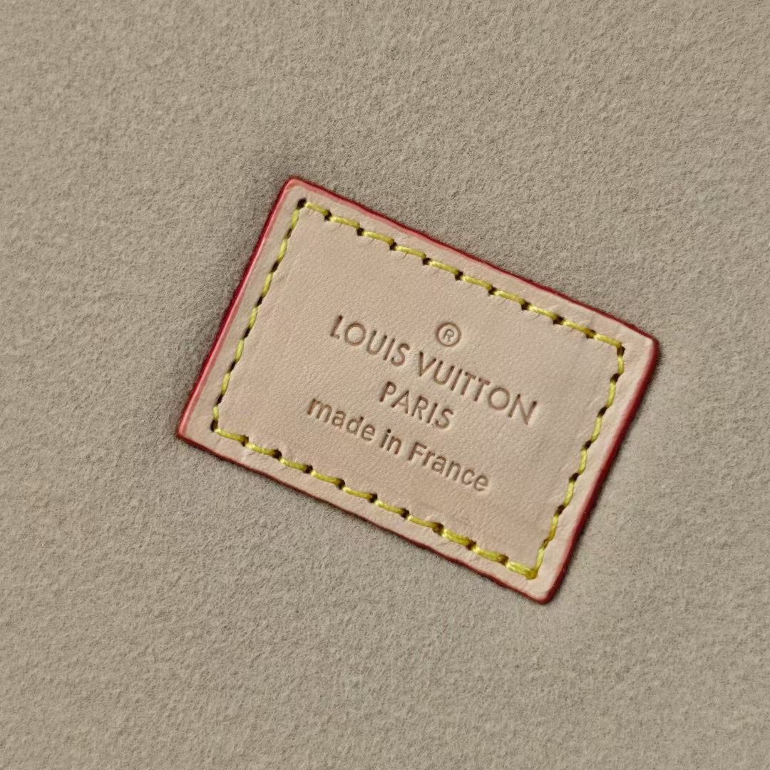 Beige inner label with 'LOUIS VUITTON' and 'Made in France' in red border