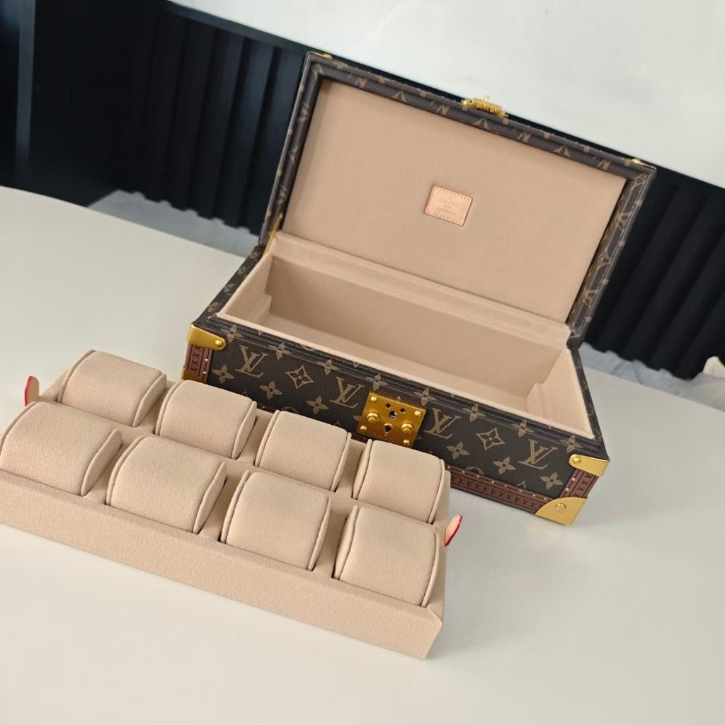 Monogram travel bag open with beige interior lining and stacked dividers