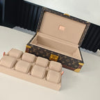 Monogram travel bag open with beige interior lining and stacked dividers