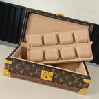 Monogram travel bag open with beige divider inserts and gold clasp
