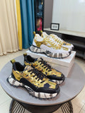Versace chunky sneakers, gold and white uppers with patterned trim, black accents