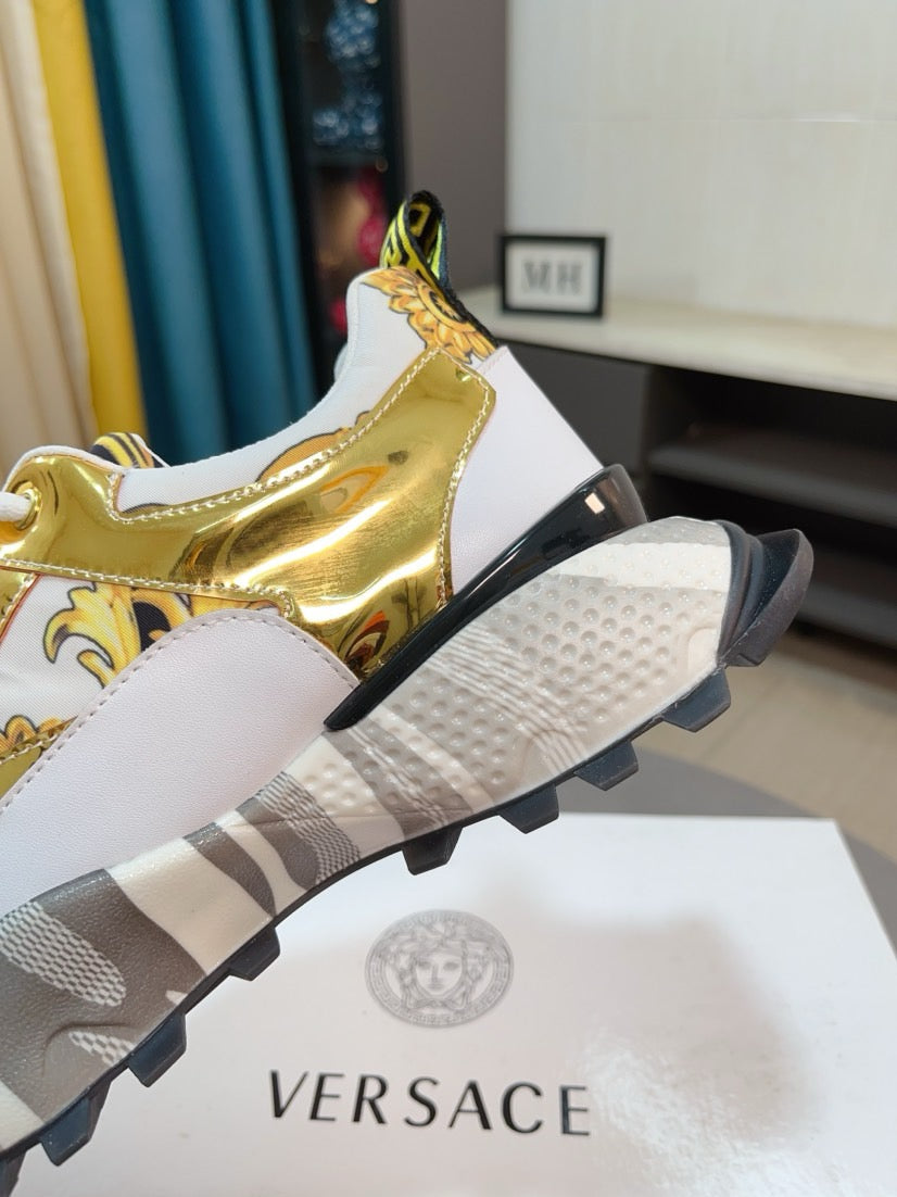 Versace chunky sneakers heel view, gold metallic upper with white laces and rubber sole