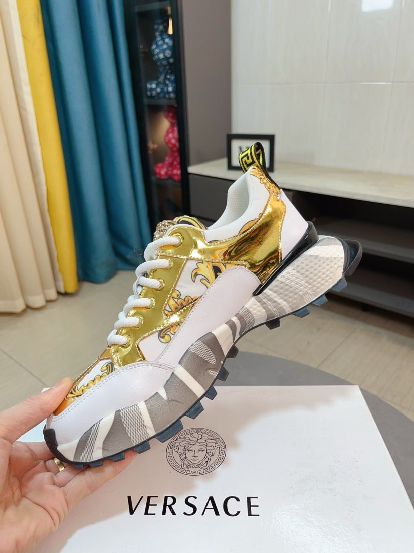 Versace chunky sneakers, gold metallic upper with white laces and gripped sole