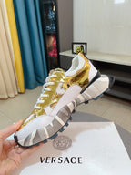 Versace chunky sneakers, gold metallic upper with white laces and gripped sole