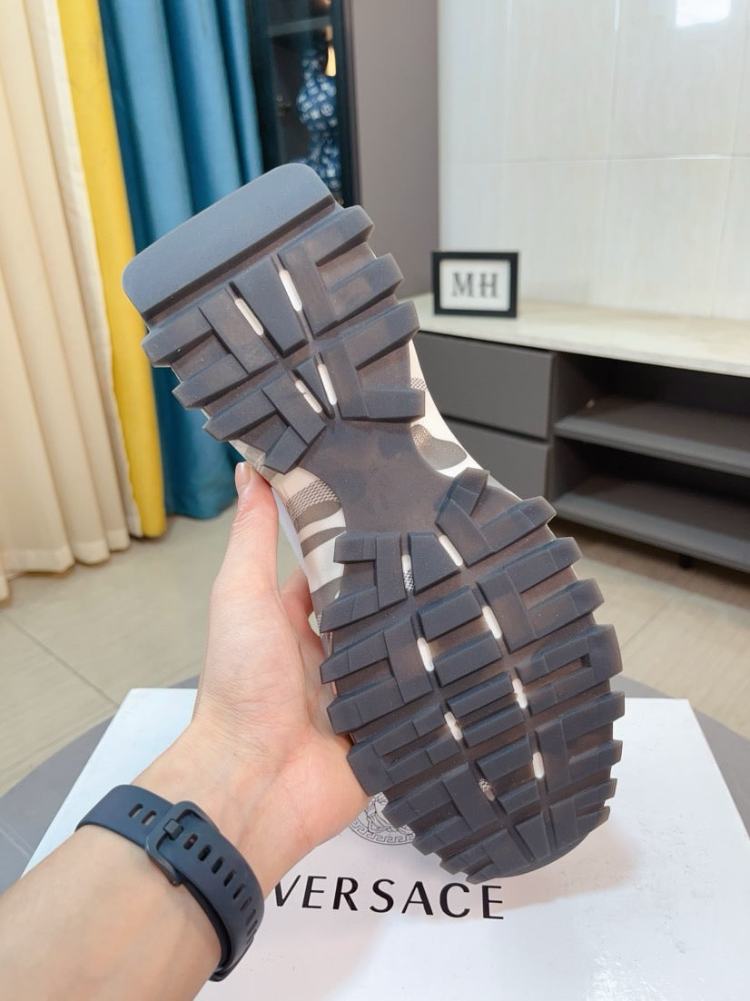 Versace chunky sneakers outsole view, dark rubber tread with ridged traction blocks