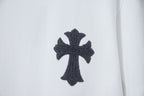White T-shirt with black cross graphic patch near the chest