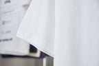 White T-shirt sleeve and draped hem detail