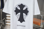 White graphic T-shirt with large black cross emblem and circular pattern