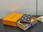 Monogram small wallet with dark brown and white pattern, side view in gift box