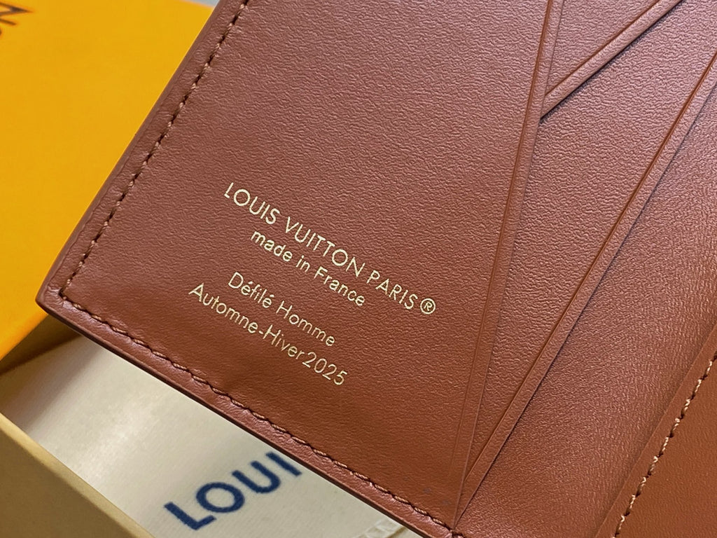 Brown leather wallet panel with 'Louis Vuitton' and 'made in France' text