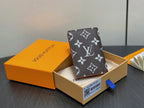 Monogram small wallet with dark brown and white pattern, upright in gift box