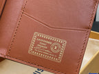 Small bag close-up: brown interior pocket organizer patch with LV emblem