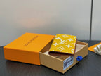 Small bag with yellow monogram print foldover front and dark trim