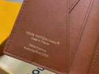 Small bag close-up: Louis Vuitton PARIS text on brown leather, made in France